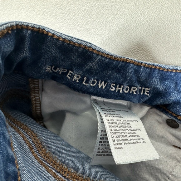 American Eagle Outfitters Super Low Shortie Cuffed Distressed Denim Shorts - Picture 3 of 6